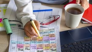 9 Tips to Find a Part-Time Job That Fits Your Busy Lifestyle - a professional workers maps out their busy schedule.