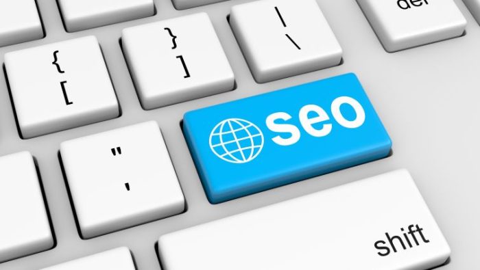 How to write an outstanding SEO resume - a keyboard with a large blue SEO button.