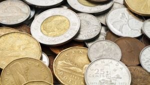 The Minimum Wage in Ontario In 2024 - a pile of Canadian coins.