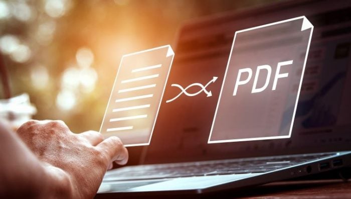 How PDF Converters Enhance Productivity in Remote Work Environments - a laptop screen with a PDF document being converted.