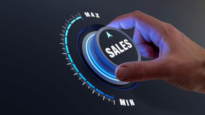 Leveraging Customer Service Insights to Drive Sales - a person turning a knob that increases sales.